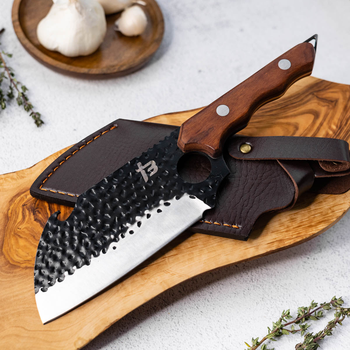 Hybrid cleaver on a cutting board
